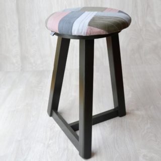 Upcycled fabric stool with wood legs painted in greenish brown by KOLLIB