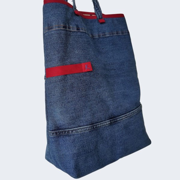 Side view of a KOLLIB upcycled denim medium bag