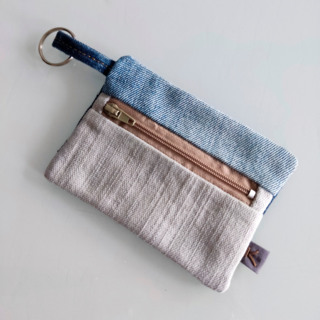 Front view of a KOLLIB patchwork upcycled denim Wallet and keychain.