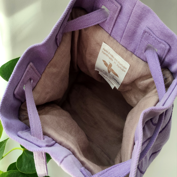 Inside view of a KOLLIB purple upcycled denim bohemian style backpack.